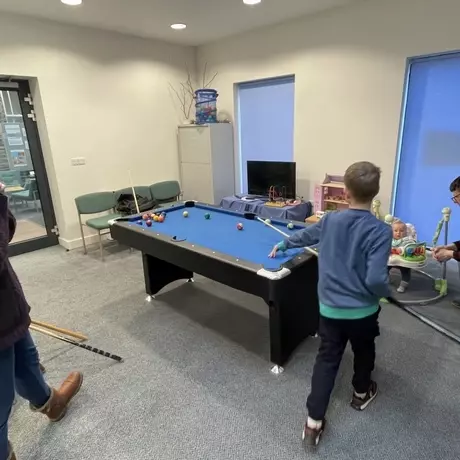 Youth group playing pool